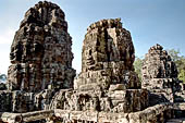 Angkor Thom - Bayon temple, second enclosure, corner towers seen from the central terrace 